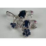 Unusual silver, CZ and sapphire bird brooch, with ruby eyes