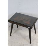 Hand carved oriental wooden side table decorated with dragons and temples