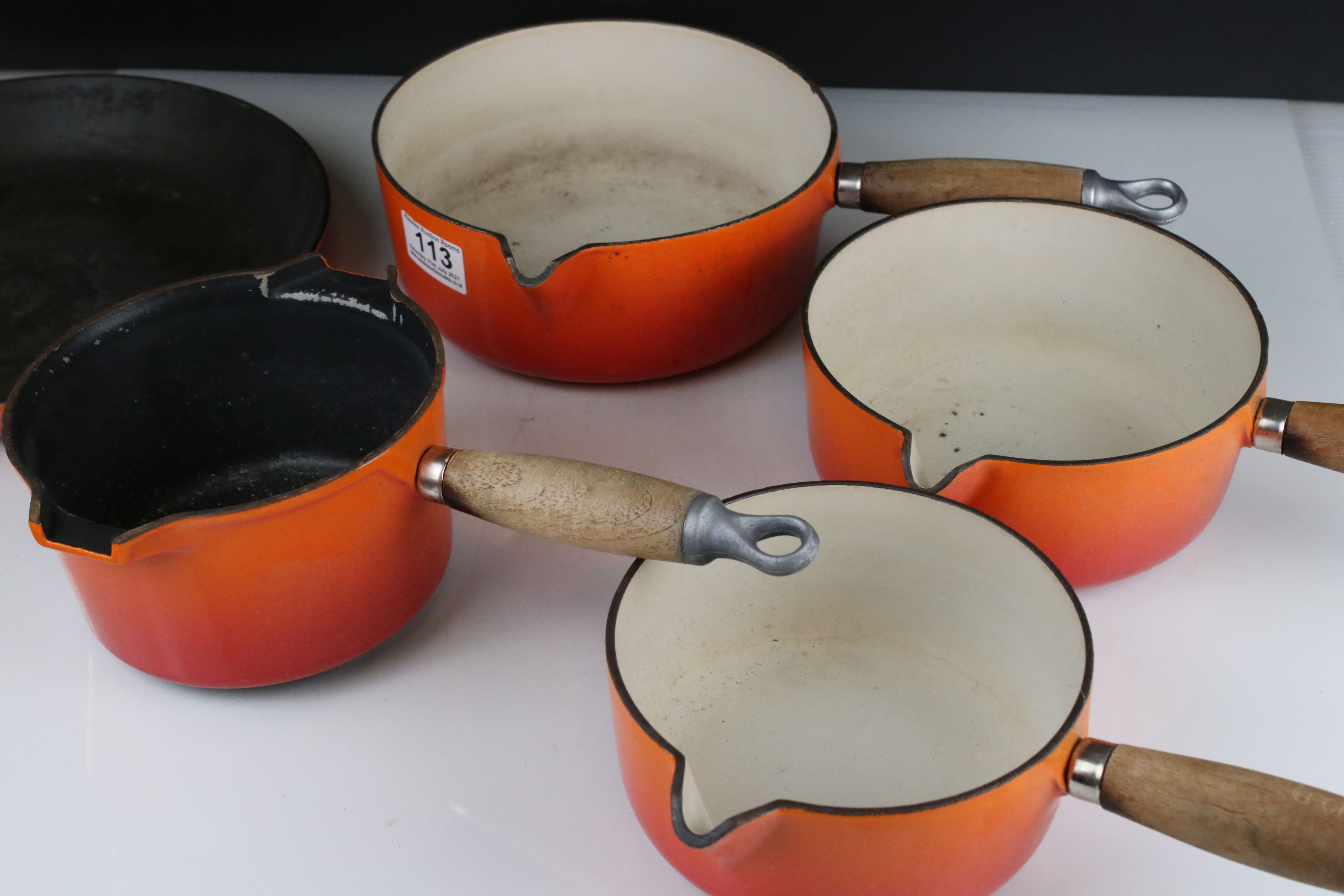 A collection of Le Creuset cast iron red pots and pans together with a fondue pan and burner. - Image 6 of 6