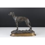 A bronze sculpture of a greyhound 20 cm long by 20 cm tall x 8 cm depth.