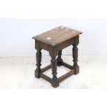 Late 17th century oak joint stool, the moulded rectangular top on turned legs and square section