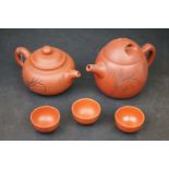 Yixing clay teapot, one other & three tea bowls