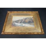 An early 20th century gilt framed Continental watercolour townscape river scene indistinct signature