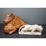 Decorative hand carved stone tiger, together with a hand carved wooden Welsh dragon