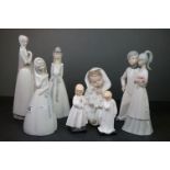 Nao Figure of a Young Child wrapped in a Blanket together with Five Spanish Lladro style Figures
