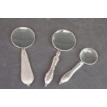 Three White Metal Handled Magnifying Glasses