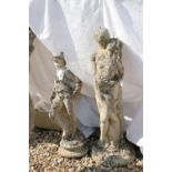 Two reconstituted stone garden statues to include a couple in embrace.