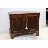 19th century Rosewood Cabinet with gadrooned edge, the two panel doors opening to shelves, raised on