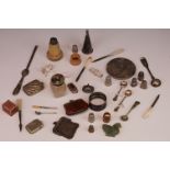 A box of mixed collectables to include vesta cases, napkin ring, thimbles and a purse.