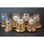 A collection of seven dome topped anniversary clocks to include Kundo and Bentina examples.