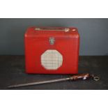 A vintage red Roberts radio model No.61088 together with a knife sharpener / butchers steel