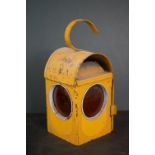 A yellow vintage road workers amber warning lantern.