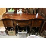 Regency style Mahogany Sideboard with serpentine front, the central drawer flanked by two cupboard