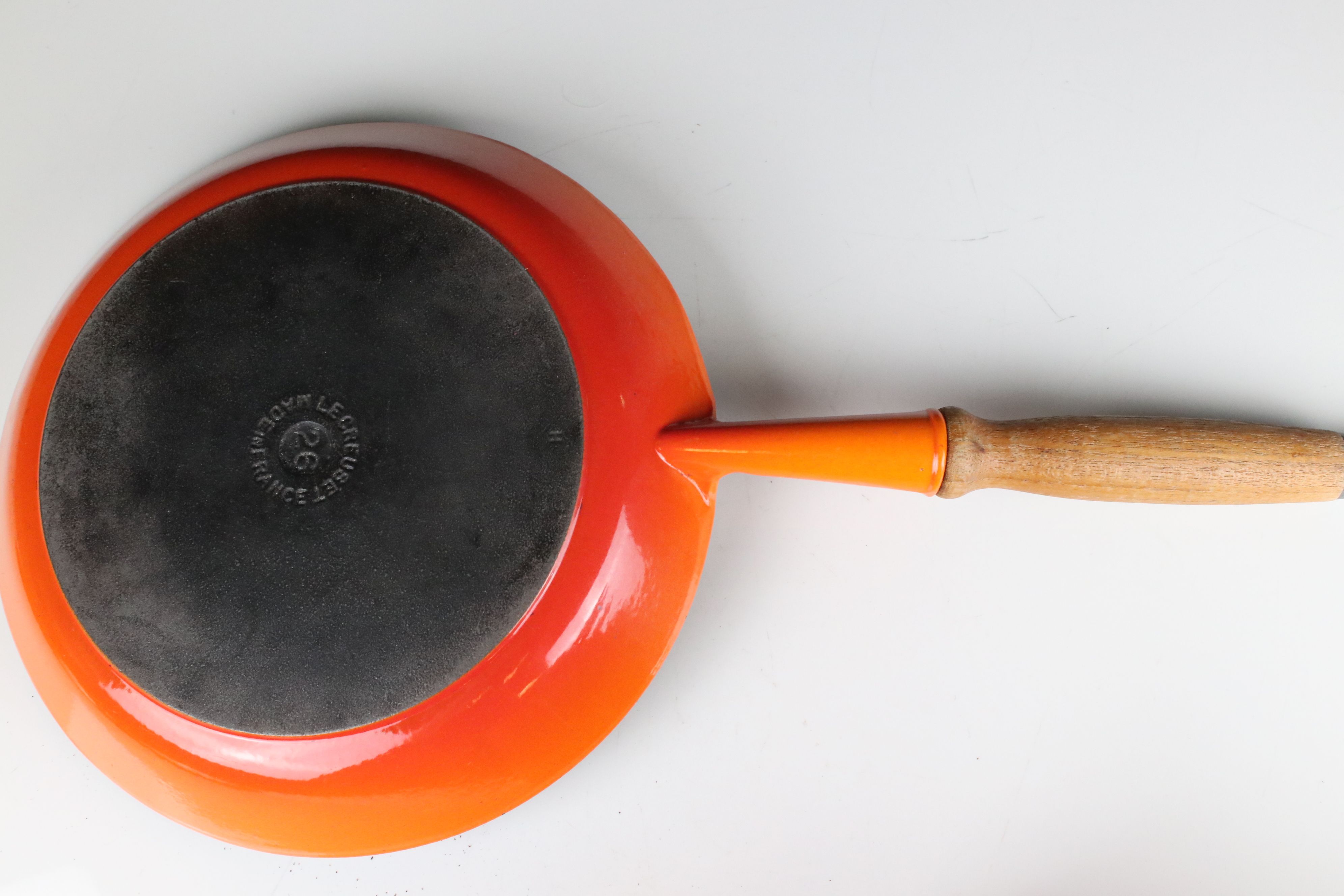 A collection of Le Creuset cast iron red pots and pans together with a fondue pan and burner. - Image 5 of 6