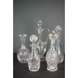 A collection of four crystal cut glass crystal decanters together with a Kosno crystal claret jug.