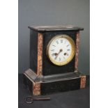 A French slate mantle clock with marble decoration.
