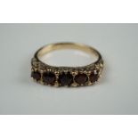 9ct gold Victorian ring, set with five garnets