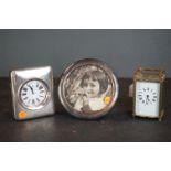 A group of mixed collectables to include a carriage clock, a white metal circular frame and a