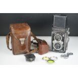 A Cased Rolleiflex Compur Rapid Franke & Heidecke Braunschweig twin reflex camera in Leather case.