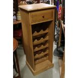 Pine Cabinet with single drawer above a wine rack, 43cms wide x 112cms high