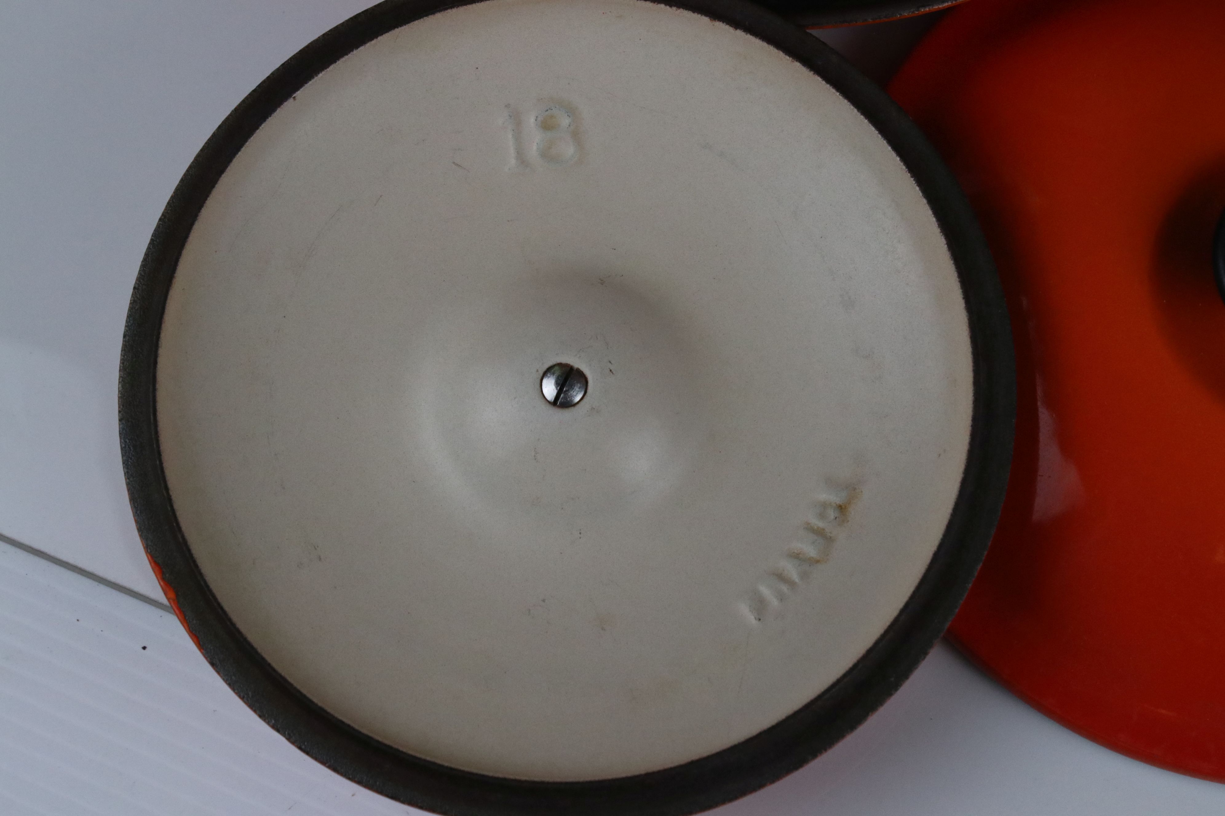 A collection of Le Creuset cast iron red pots and pans together with a fondue pan and burner. - Image 2 of 6