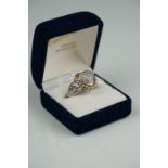 Heart shaped ring with pave set diamonds