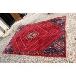 Red ground, vintage persian Qashqai tribal carpet, patch on one corner and in middle