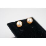 Pair of cultured pearl stud earrings on silver posts