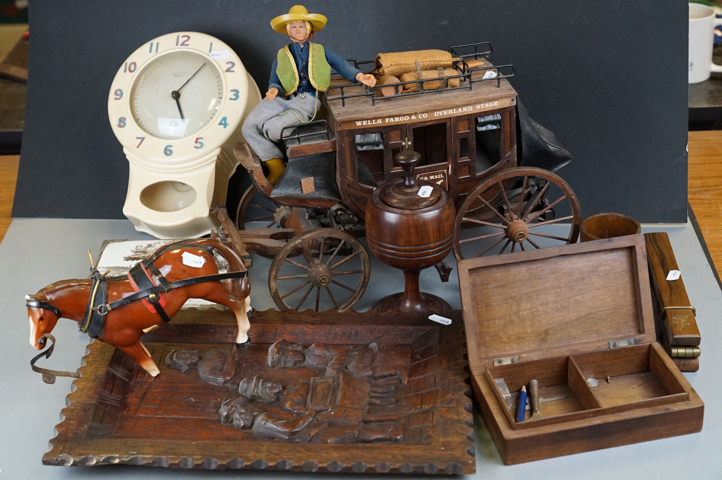 A box of mixed collectables to include a Smiths wall clock, a wooden Wells Fargo US Mail model