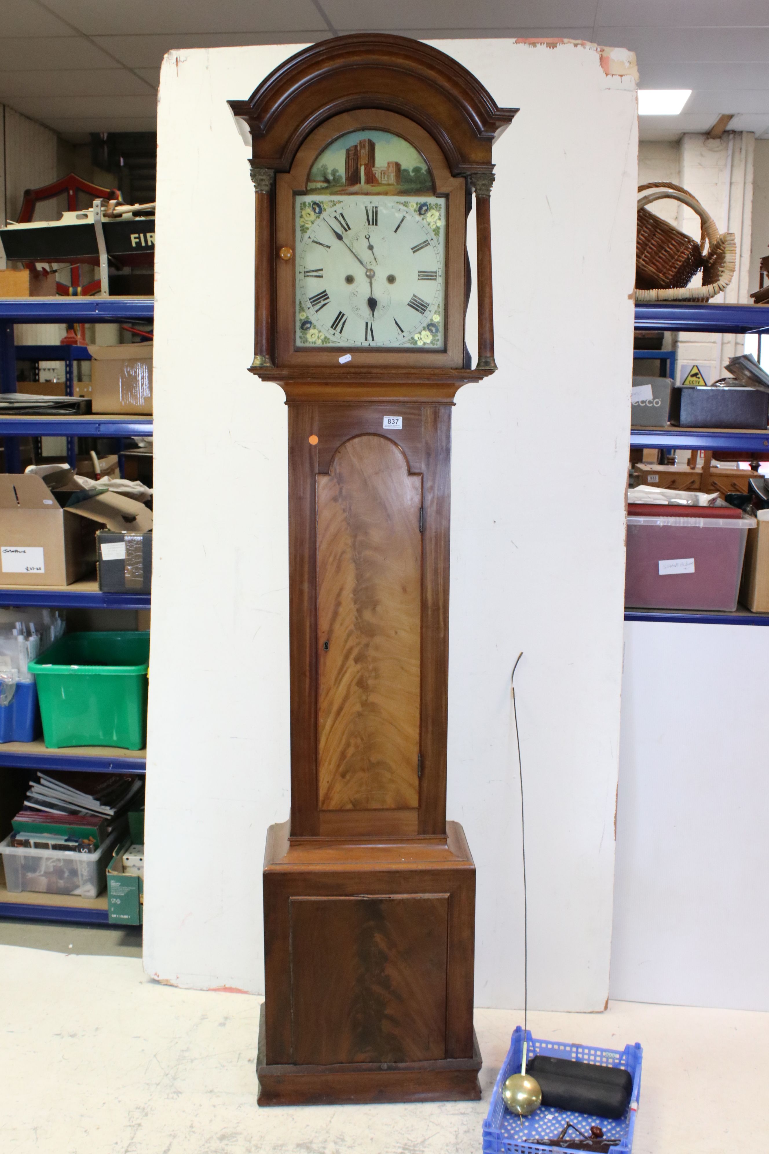 19th century Mahogany 8 day Longcase Clock, the arched dial painted with the scene of a Folly, the