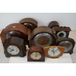 Group of nine mantle clocks in two boxes