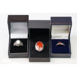 A collection of three boxed ladies 925 sterling silver rings to include an Opal and marcasite