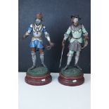 Two French painted spelter figure, one wearing a crown and the other with sword and written scroll