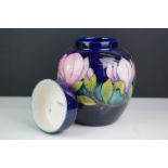 Moorcroft Ginger Jar and Lid in the Magnolia pattern on a blue ground, impressed marks to base,