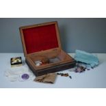 A vintage wooden box containing semi precious stones together with a quantity of vintage costume