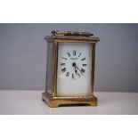 A vintage brass cased carriage clock retailed by Ross & Sons of Winchester.