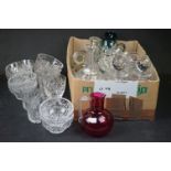 A large box of mixed glassware to include decanters, glasses and dishes.