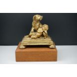 Gilt Bronze Group of a Dog protecting a sleeping child, possibly French 19th century, 16cms high,