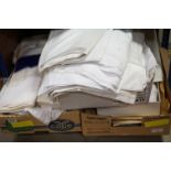 A collection of mixed vintage linen to include table cloths and sheets etc..