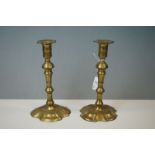 Pair of Georgian brass candlesticks on petal bases, height approx. 20cm