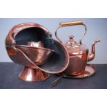 A small collection of antique copper ware to include a coal scuttle, jug and kettle.