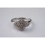 White gold and diamond cluster ring