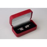 Pair of silver owl cufflinks, with ruby eyes