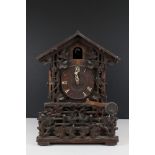 Late 19th / Early 20th century Black Forest carved Oak Cased Cuckoo Clock, with paper label to verso