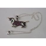 Silver and ruby set pendant necklace, in the form of a dog