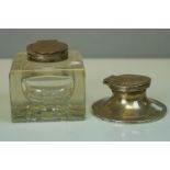 A fully hallmarked sterling silver capstan inkwell together with a glass inkwell with hallmarked