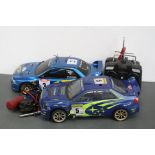 A Kyosho 4WD Subaru Nitro 1/10 scale Rally De France, belt driven RC car, McCrae / Grist together