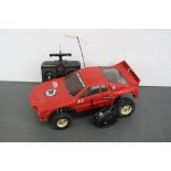 A Tamia Lancia Rally 1/10 scale remote control car 58040 c.1983 on ORV chassis with high impact