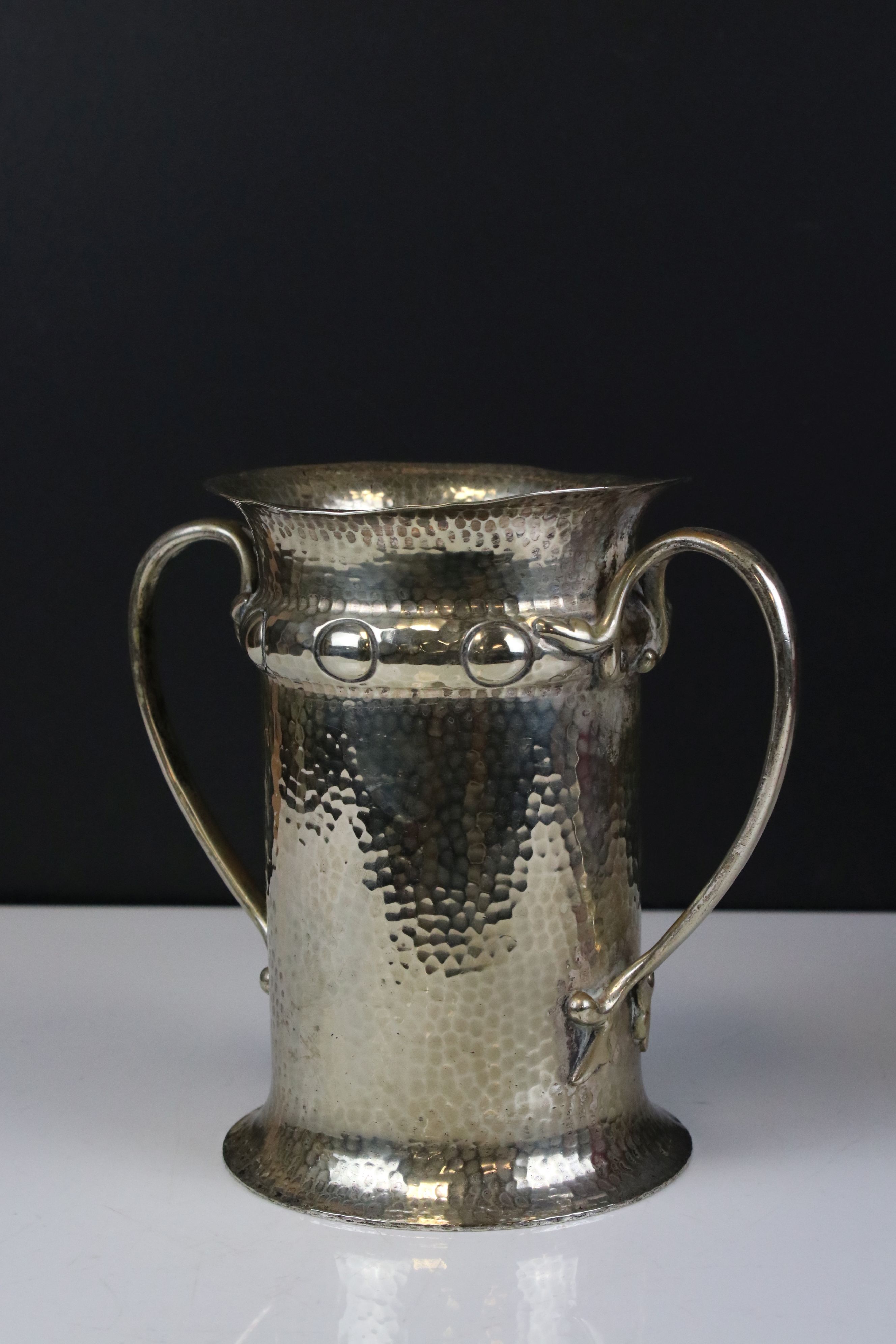 Art Nouveau Polished Hammered Pewter Twin Handled Vase, marks to base for H J Cooper & Co Ltd, 19cms