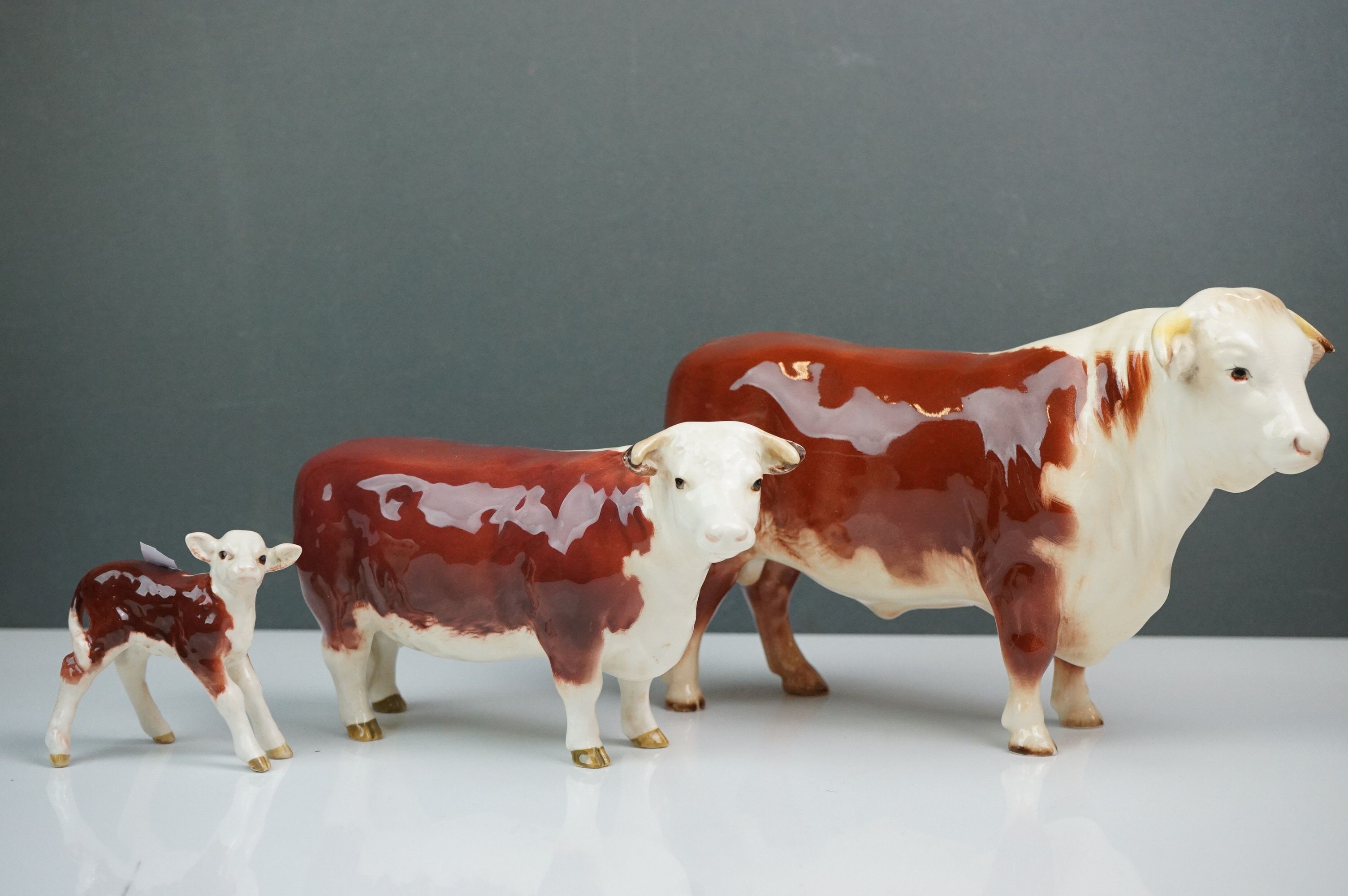 Beswick Hereford Family including Bull (no. 949), Cow (no.1360) and Calf (no.1406B)